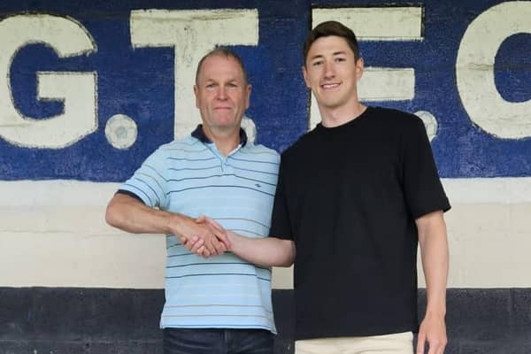 Russ Wilcox welcomes new signing Adam Crookes. Photo by Dave Horsley
