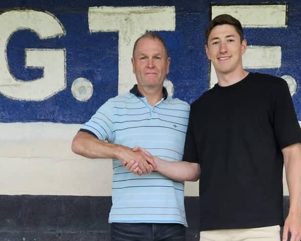 Russ Wilcox welcomes new signing Adam Crookes. Photo by Dave Horsley