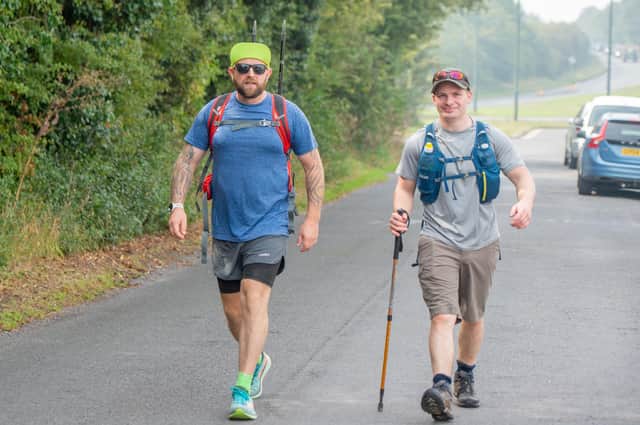 ​Mark Stones and Jason Maltby on their Wolds walk, pictured just outside Laceby on Friday morning. Photo: John Aron Photography