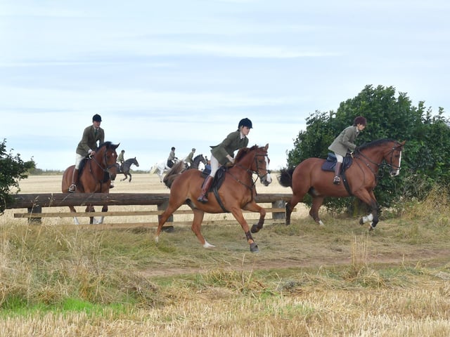 Riders with the Blankney Hunt in full flight.