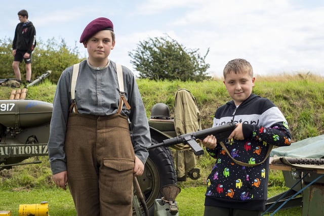 Trying out the guns for size: Alfie Oglesby, age 12, with Finley Jarvis Boyall, age 11.