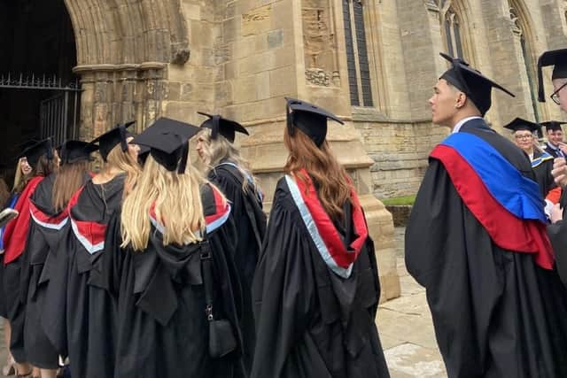 The graduates head into the Stump for the ceremony.