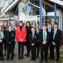 Victoria Atkins (centre) with Somercotes Academy Careers Leader Laura Brown (left) and Principal Frances Green plus some of the students who attended the question-and-answer session. Photo by Jon Corken