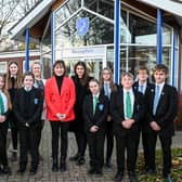 Victoria Atkins (centre) with Somercotes Academy Careers Leader Laura Brown (left) and Principal Frances Green plus some of the students who attended the question-and-answer session. Photo by Jon Corken