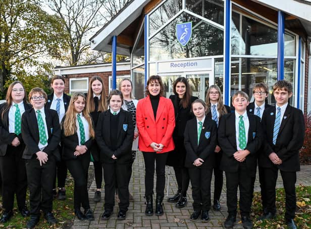 Victoria Atkins (centre) with Somercotes Academy Careers Leader Laura Brown (left) and Principal Frances Green plus some of the students who attended the question-and-answer session. Photo by Jon Corken
