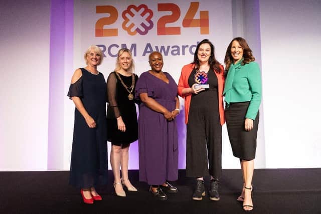 Robyn receiving her award on stage