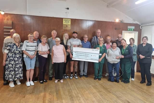 The presentation event following the Mayhem Gym fundraiser in aid of the Boston Pulmonary Fibrosis Support Group. Tom and Sarah Chenery are pictured presenting the cheque to group founder Clare Verrall-Champion.