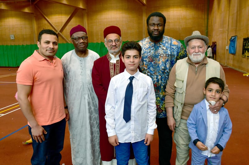 Pictured (from left) Moustafa Abouelkhir, Abdulmalik Bako, Abdulhameed Qureshi, Marwn Alrfay, 14, Ahmad Oladosu, Majid Kabani, and Mayar Alrfay, seven.