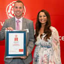 Richard Bestwick, managing director of Don Amott's Lakeside Park, receives the prestigious award, flanked by his wife Laura (right) and Lady Victoria Borwick, chair of VisitEngland. (PHOTO BY: Kit Fanner, of On Location Events)