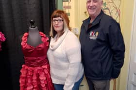 Owner of Kennedy's, Kim Kennedy, with RBL Poppy Appeal organiser Julian Millington with the Poppy Dress. Photo: Lindy Taylor