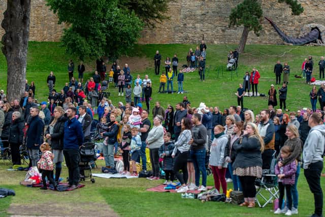 Crowds gather at Lincoln Castle to watch the funeral.