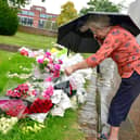 Sandra Lee looking at the floral tributes outside Boston Stump.