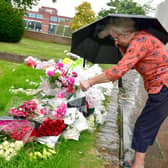 Sandra Lee looking at the floral tributes outside Boston Stump.