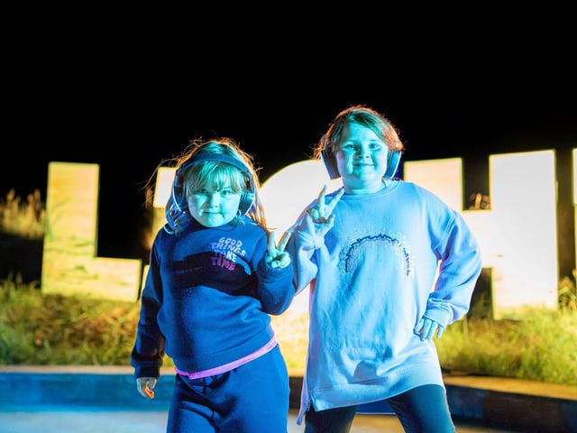 Two youngsters enjoy the silent disco.