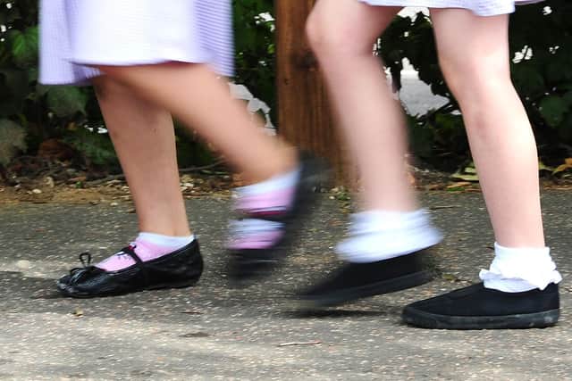 File photo date 15/07/14 of a generic stock photo of school girls walking to school. Many children are not ready to start school when they first enter a classroom, a poll of headteachers suggests.