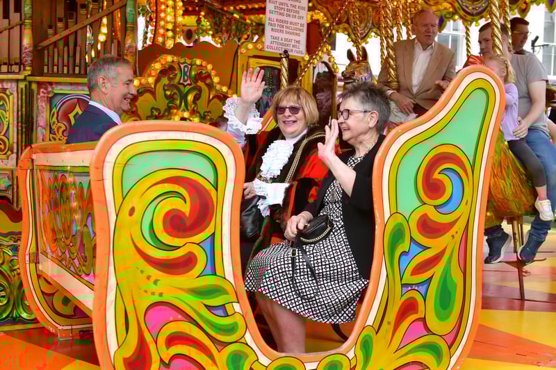Mayor of Boston Coun Helen Staples waves for the camera from the gallopers.