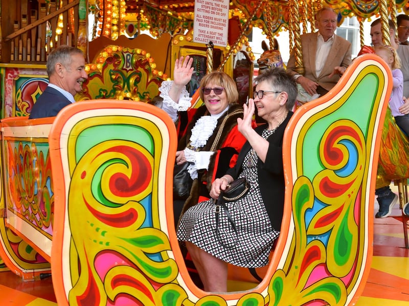 Mayor of Boston Coun Helen Staples waves for the camera from the gallopers.