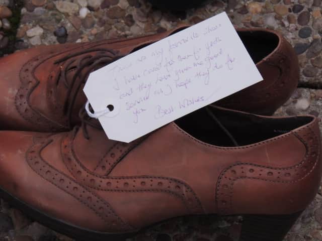 "My favourite shoes". A message tagged to a pair of donated footwear.