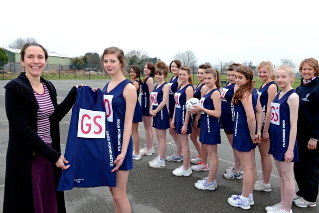 Pictured 10 years ago are U14 netball players from Queen Elizabeth's Grammar School, in Horncastle, receiving their new kit from the chairman of the school's Parents' Association Nicky Webb. The team had recently competed in the regional final of a national tournament.