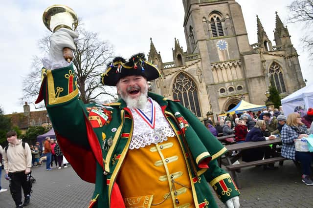 Town Crier John Griffifths rings in the Sleaford Christmas Market.
