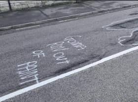 "Gonna run out of paint" spray painted on Ermine Street in Ancaster.