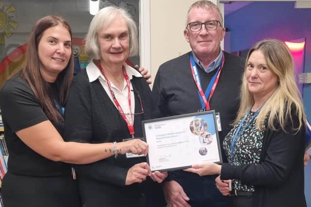 Representatives of Coningsby St Michael's Primary School with a certificate to recognise its involvement in the government's Behaviour Hubs programme. From left are pastoral manager Vicky Wise, governor Anne Simons and pastoral learning mentor Natalie Williams, alongside Anthony Bowen, of the Working Together Team in Lincolnshire, who opened the new sensory room.