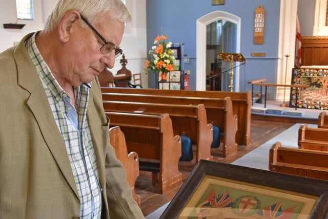 John Bird looking at a print commemorating the 1914-18 Great War at Wragby Parish Church