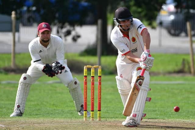 Rob Bee bats in Sunday's game. Photo: Wayne Lagden.