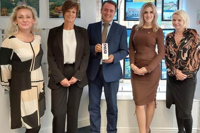 The Mundys team with their award