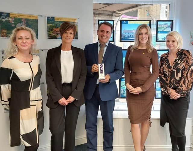 The Mundys team with their award