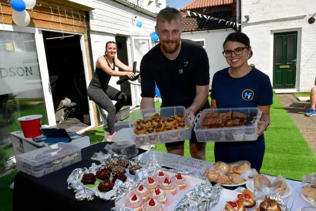 From left - Emma Hudson, Connor Yarwood and Shannon Carter on the cake stall.