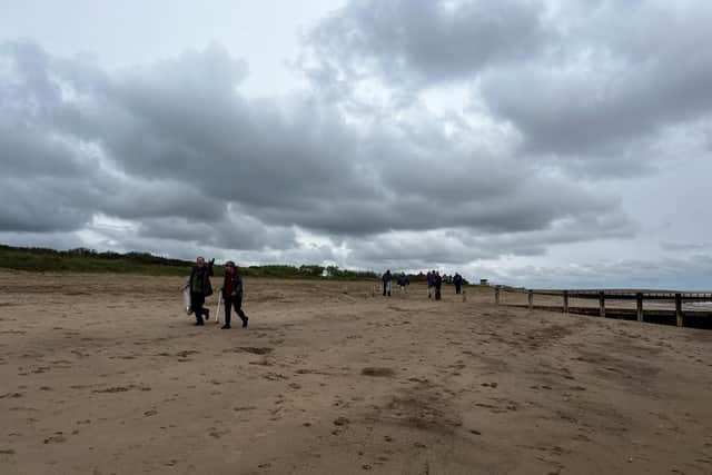 Skegness Pier and Fantasy Island volunteers with  Coastal Access for All on Skegness beach.