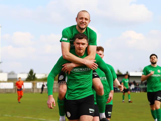 Jacob Fenton is congratulated after netting from the spot on Saturday. Photo: Steve W Davies Photography.