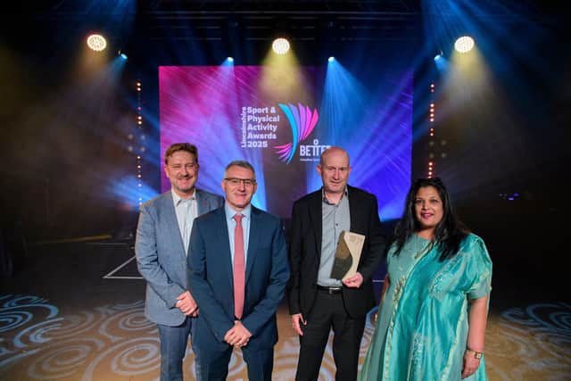 Slea Paddlers Canoe and Kayak Club Collect the Active Club Award from award judge Batul Dungarwalla