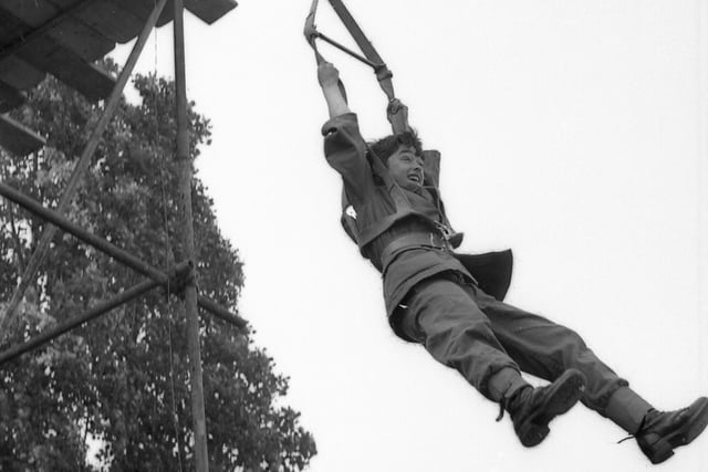 A cadet tries out the parachute harness. The Standard described him as a 'life-size Action Man' at the time, with the toy having been launched in the UK two years earlier.