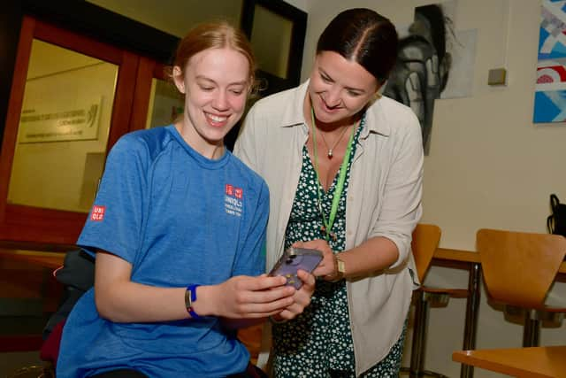 Izzy Collier, 16, looking at her GCSE results with her French teacher Amy Ellison at KSHS.