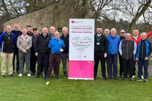 Seniors Captain Chris Barber and members of Louth Golf Club with United Lincolnshire Hospitals Charity Fundraiser Connor Hill.