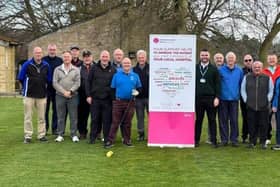 Seniors Captain Chris Barber and members of Louth Golf Club with United Lincolnshire Hospitals Charity Fundraiser Connor Hill.