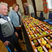 Richard and Ann Lane of East Barkwith browse the stalls at Wragby Apple Day. Photos: D.R.Dawson Photography