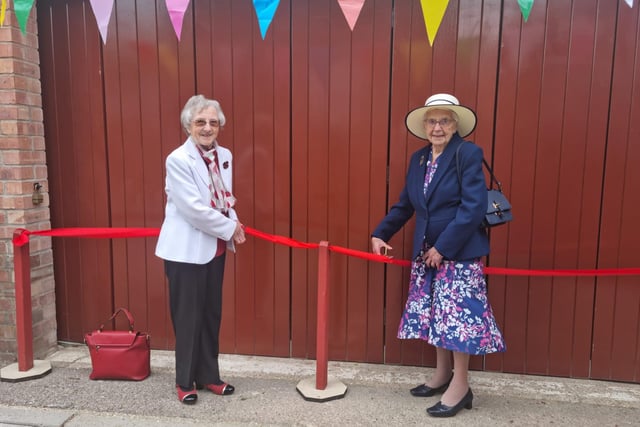Eileen Chantry and Mavis Stone cut the ribbon at the Heritage Centre.