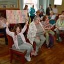 Campaigners trying to save Charles Street pond, singing 'Our Pond', lead by Tamsin Hunkin of Hope Sings Eternal singing group. 
Pictured is six-year-old Ella-Grace Collins with her banner.