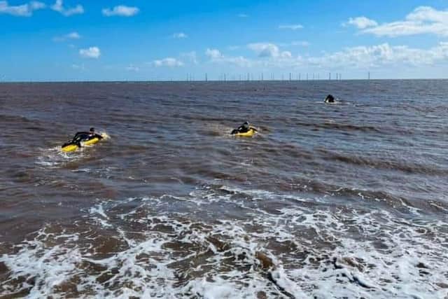 RNLI Lifeguards training in the sea.