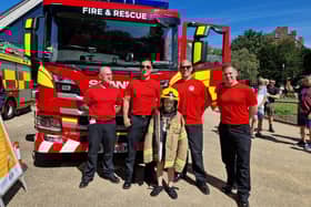 Edward Overton, 7, seeing what it would feel like to be a member of Skegness fire crew at the Carnival 999 Day.
