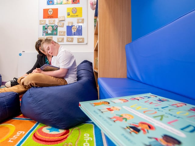 The reading area has comfortable beanbags to relax on.