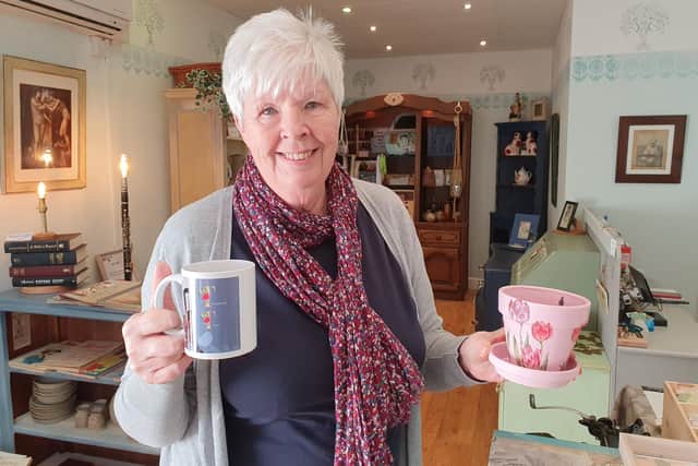 Roberta Hunt with some of her goods in Treasured Trove.