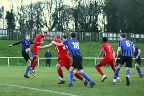 Player-boss Tom Ward gets up to head at goal during the defeat at Sherwood Colliery. Photo: Steve W Davies Photography.