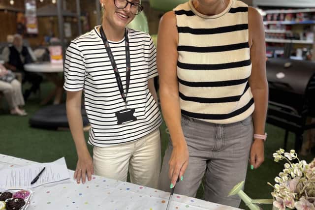 Libby and Phllippa Stubbs cut the cake at Woodthorpe Garden Centre