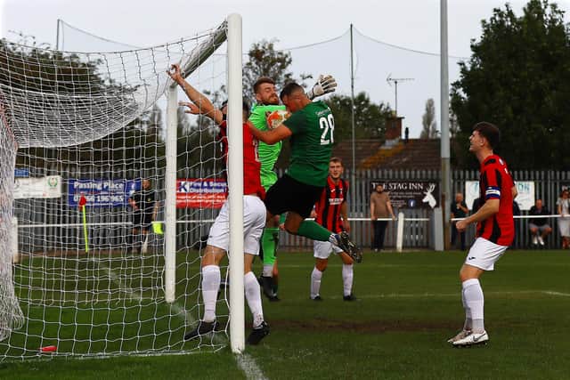 Dom Kew (no.28) bundles home the opening goal at Kimberley. Photo: Steve W Davies Photography.