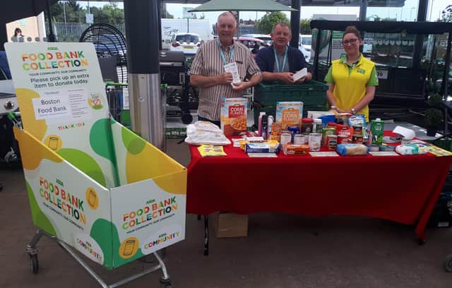 Helping collect donations for those in need, Asda and Boston Food Bank. Pictured (from left), Bob Taylor and Trevor Baily, of Boston Food Bank, and Michelle Holland, of Asda.