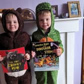 Rowan and Reuben Spencer as the Cranky Bear and a dinosaur from Saturday Night at the Dinosaur Stomp.